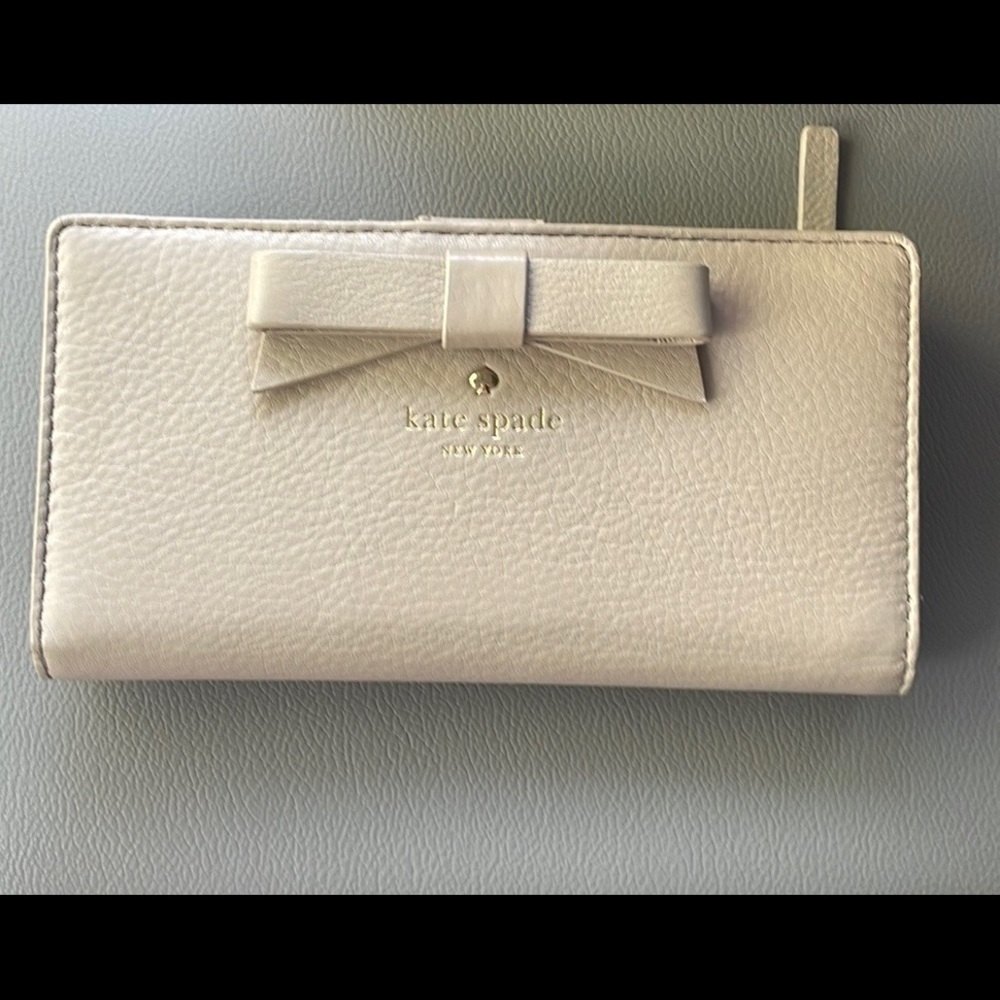 kate spade pale pink bow zip-around wallet